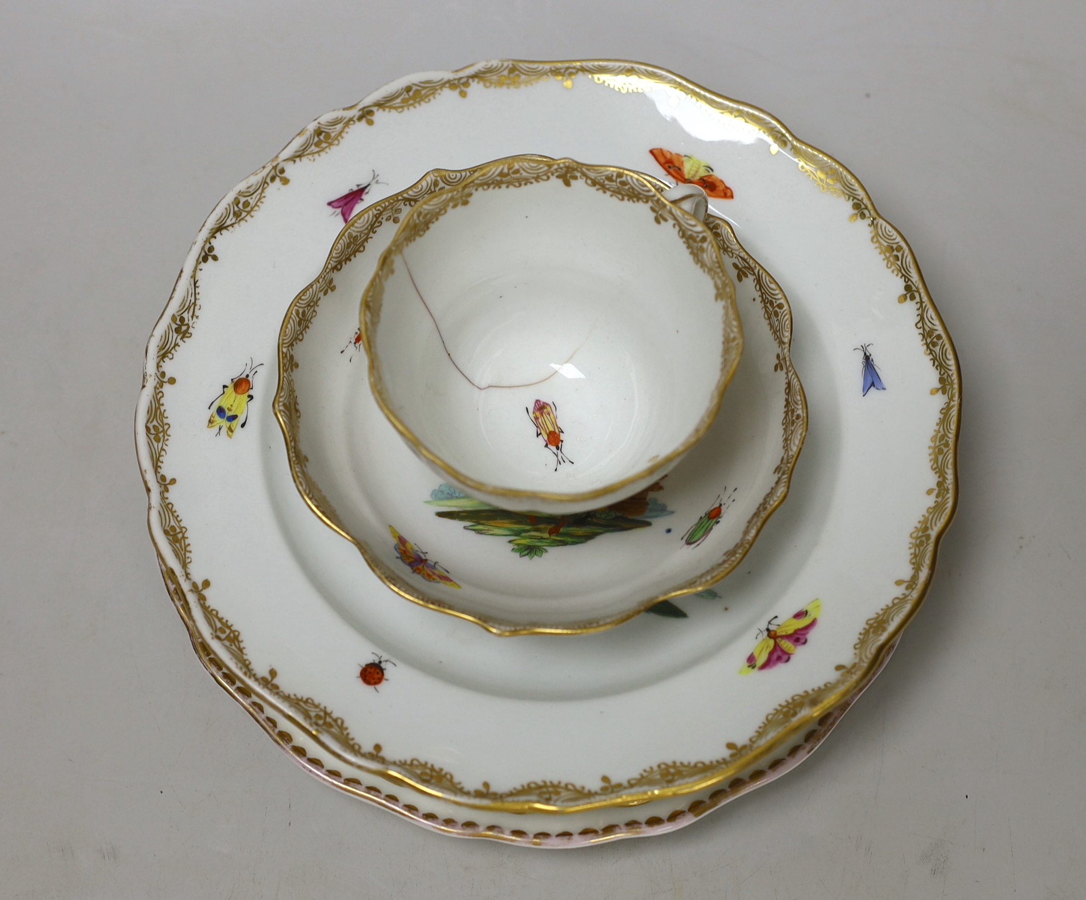 Five 19th century Meissen porcelain items including three plates, a dish and a cup and saucer, most items outside decorated, largest plate 23.5cm